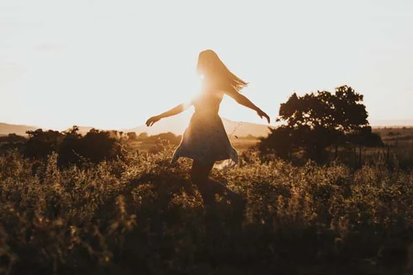 Photo by Jackson David: https://www.pexels.com/photo/woman-turning-around-on-green-fields-2868441/