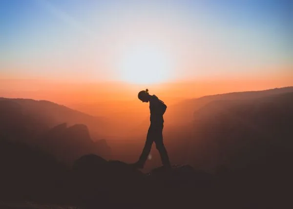 Man walking in scenic sunset