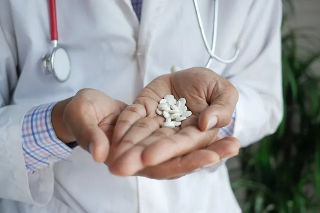 A doctor holding medication