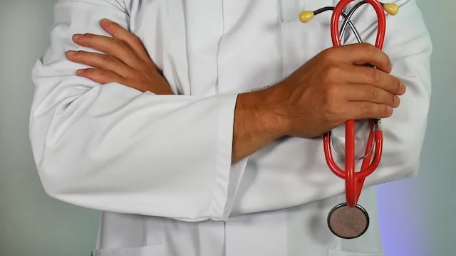 A doctor holding medication