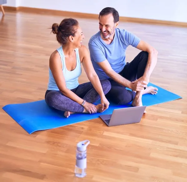 an older couple on an exercise mat