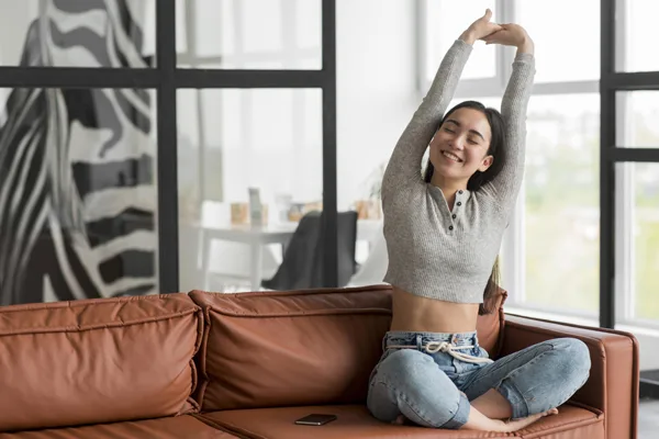 female stretching on a couch