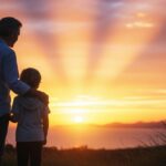 A parent holding a young child’s hand while looking toward a bright horizon, symbolizing future planning and protection.