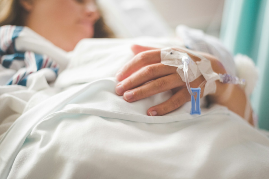 woman in hosp;ital with monitors on her hand